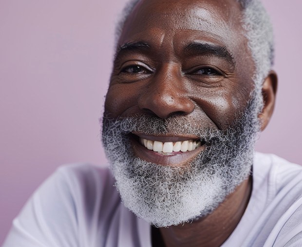 Closeup of man in white shirt smiling